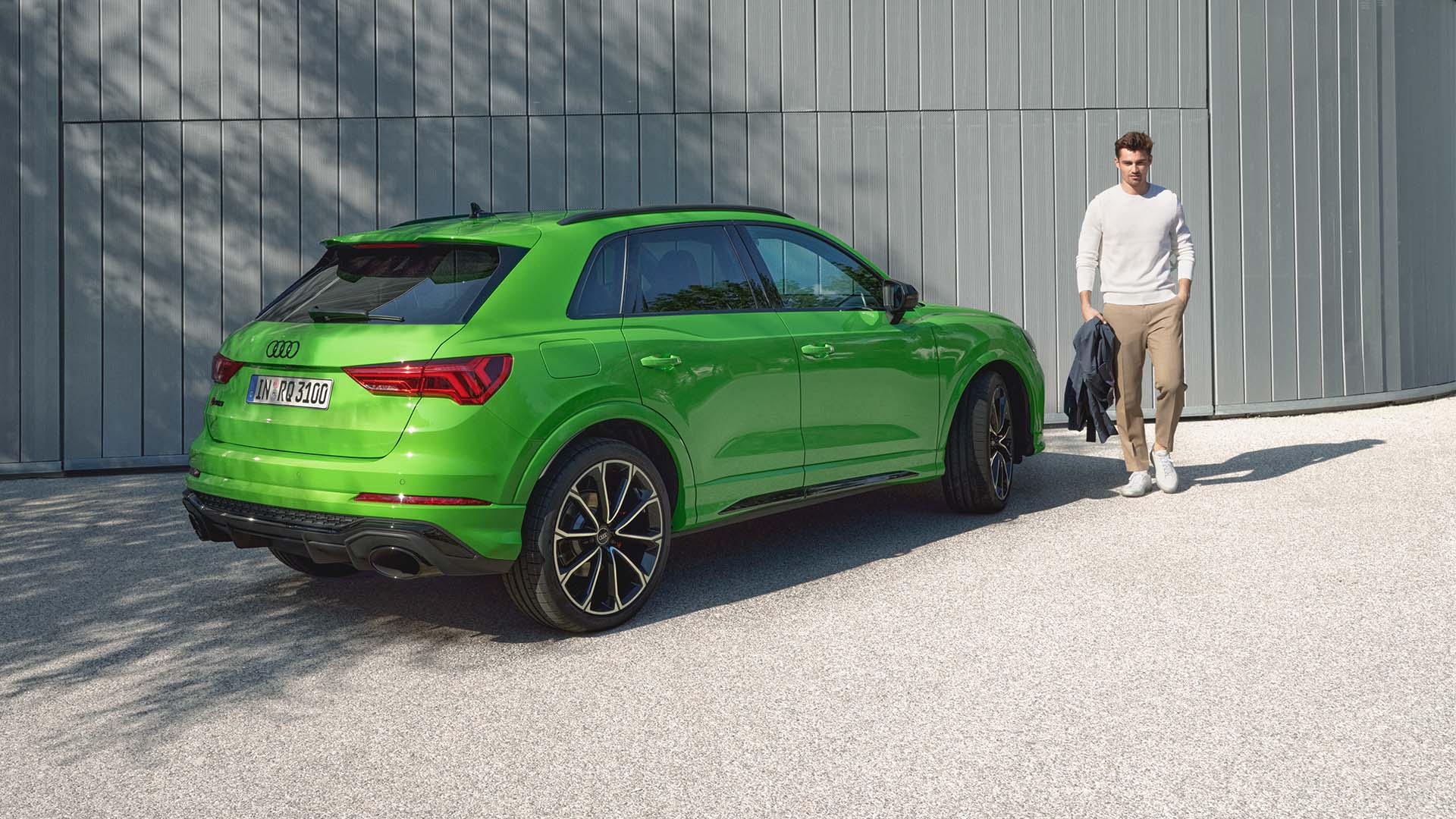 Audi RS Q3 side rear view with model on the side