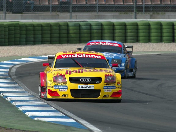 A picture showing two Abt-Audi TT-R race cars on track in 2002.