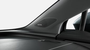 Close-up of a sleek Sonos speaker integrated into an Audi vehicle dashboard, showcasing modern design and technology in a luxury vehicle.