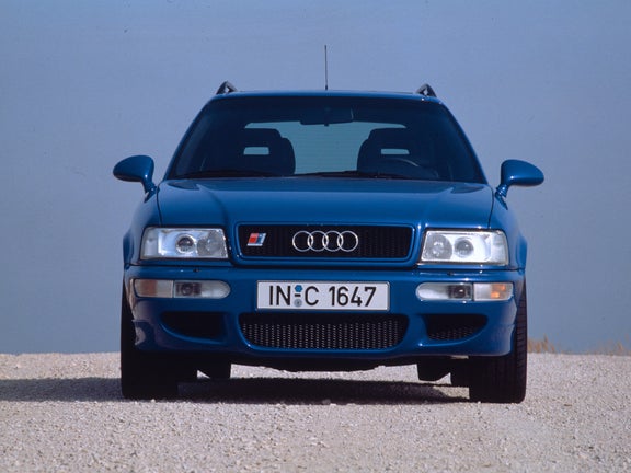 Front view of a blue Audi Avant RS 2 in front of a blue sky
