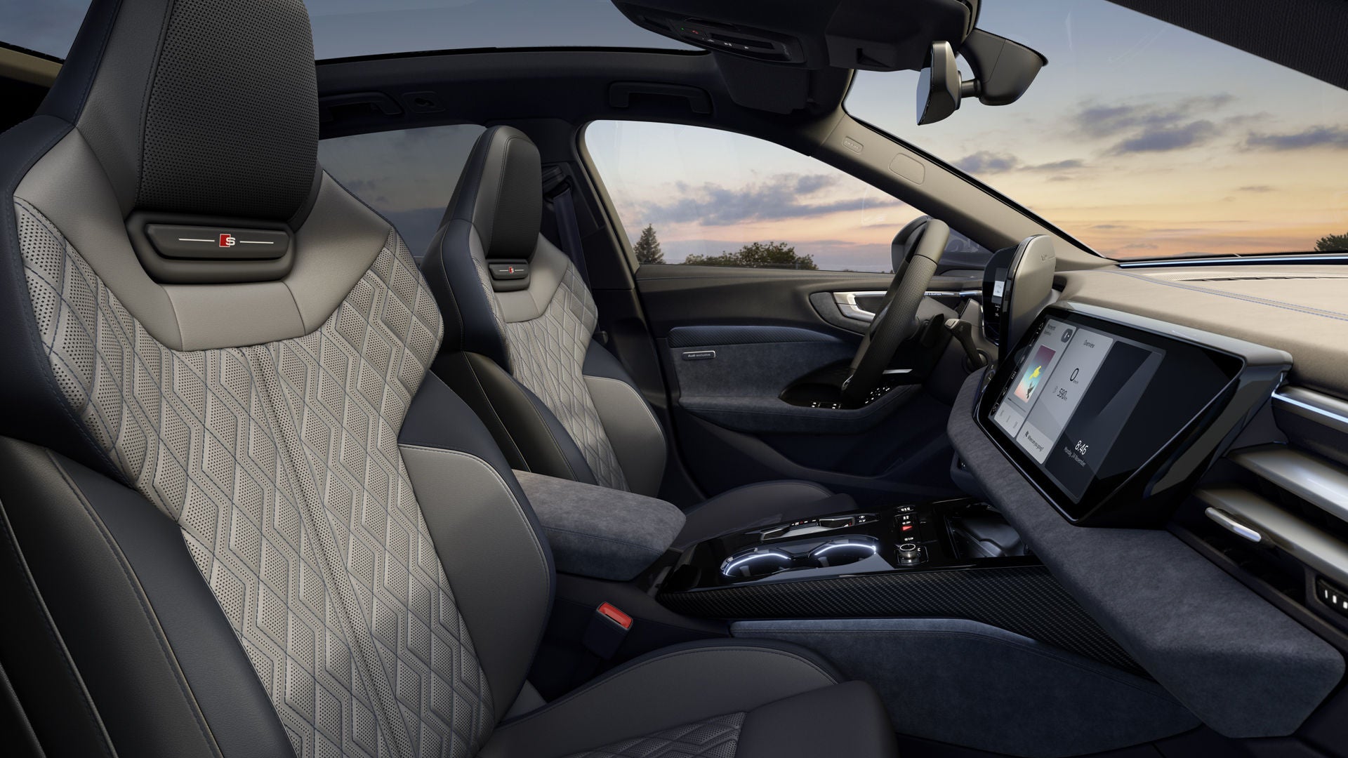 View through the front passenger window into the cockpit of the A5 Avant. The seat upholstery is Jet Grey with contrasting stitching in Baikal Blue.