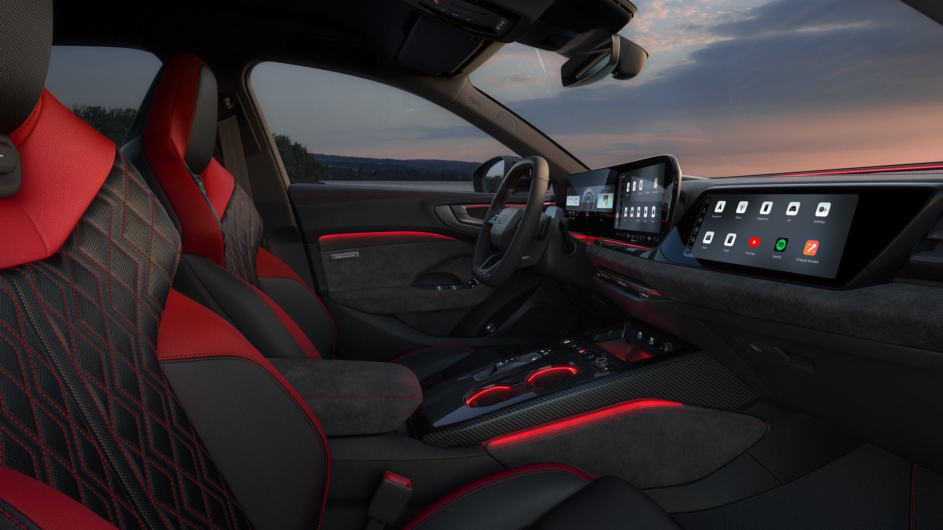 Utsikt genom passagerarfönstret in i förarhytten på A5 e-hybrid. Klädseln är svart med röda detaljer.