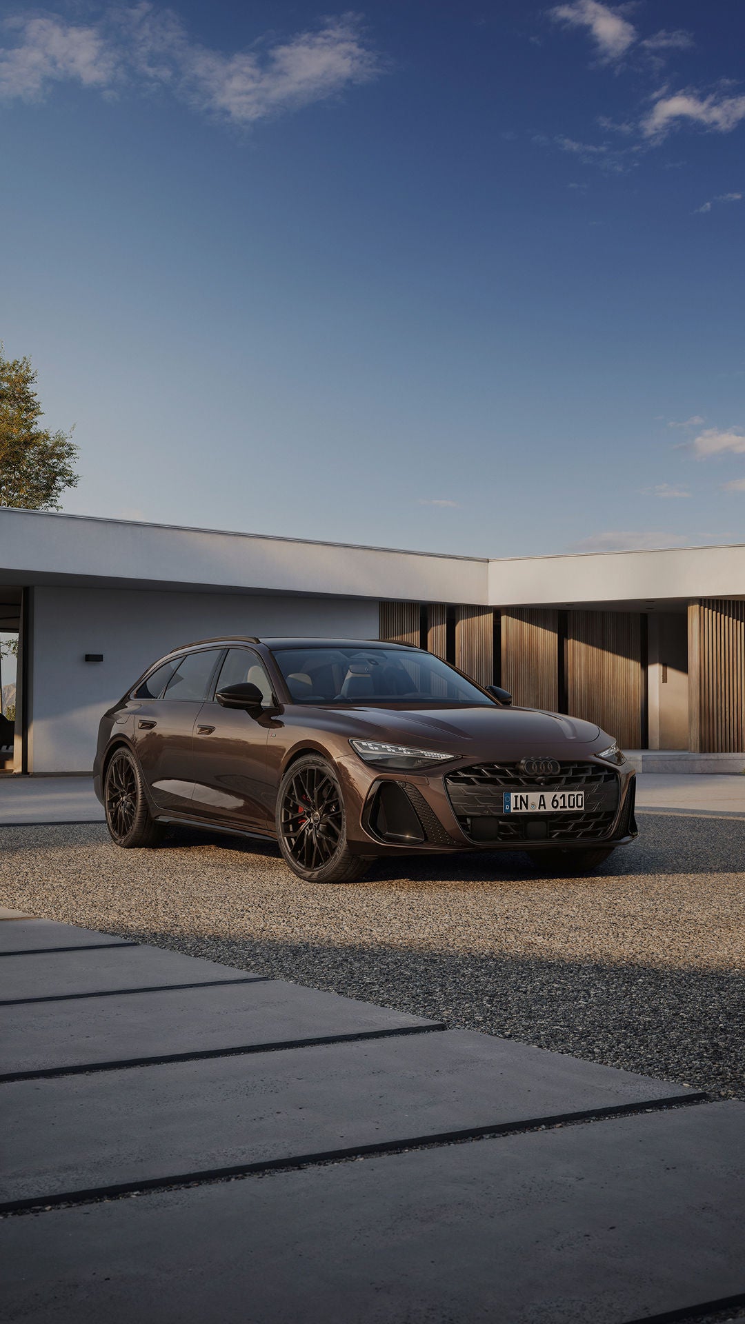 Audi A6 parked on patio outside of modern property