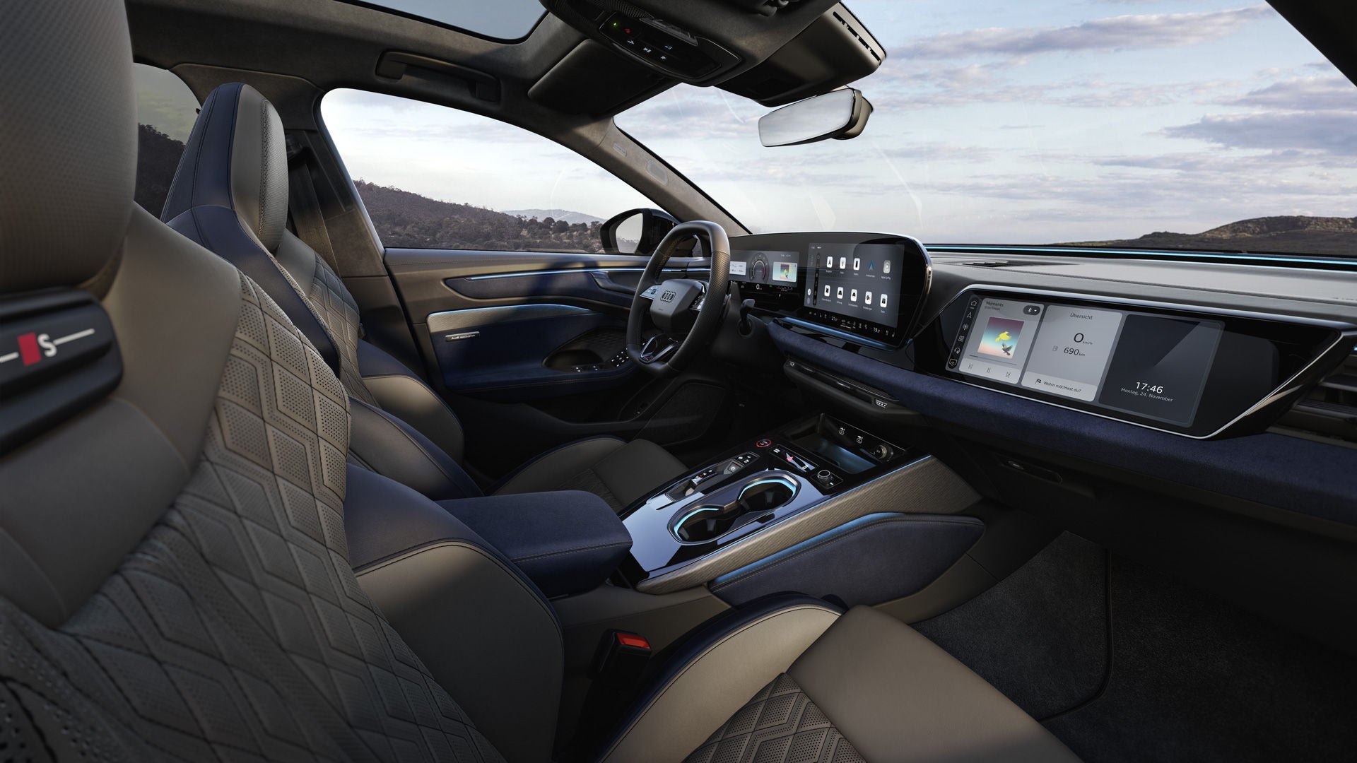 Blick durch das Beifahrerfenster in das Cockpit der A6 Limousine. Die Bezüge sind Neodymgold.