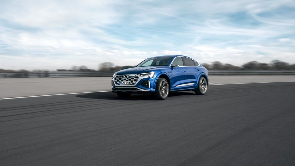 Audi SQ8 driving past.