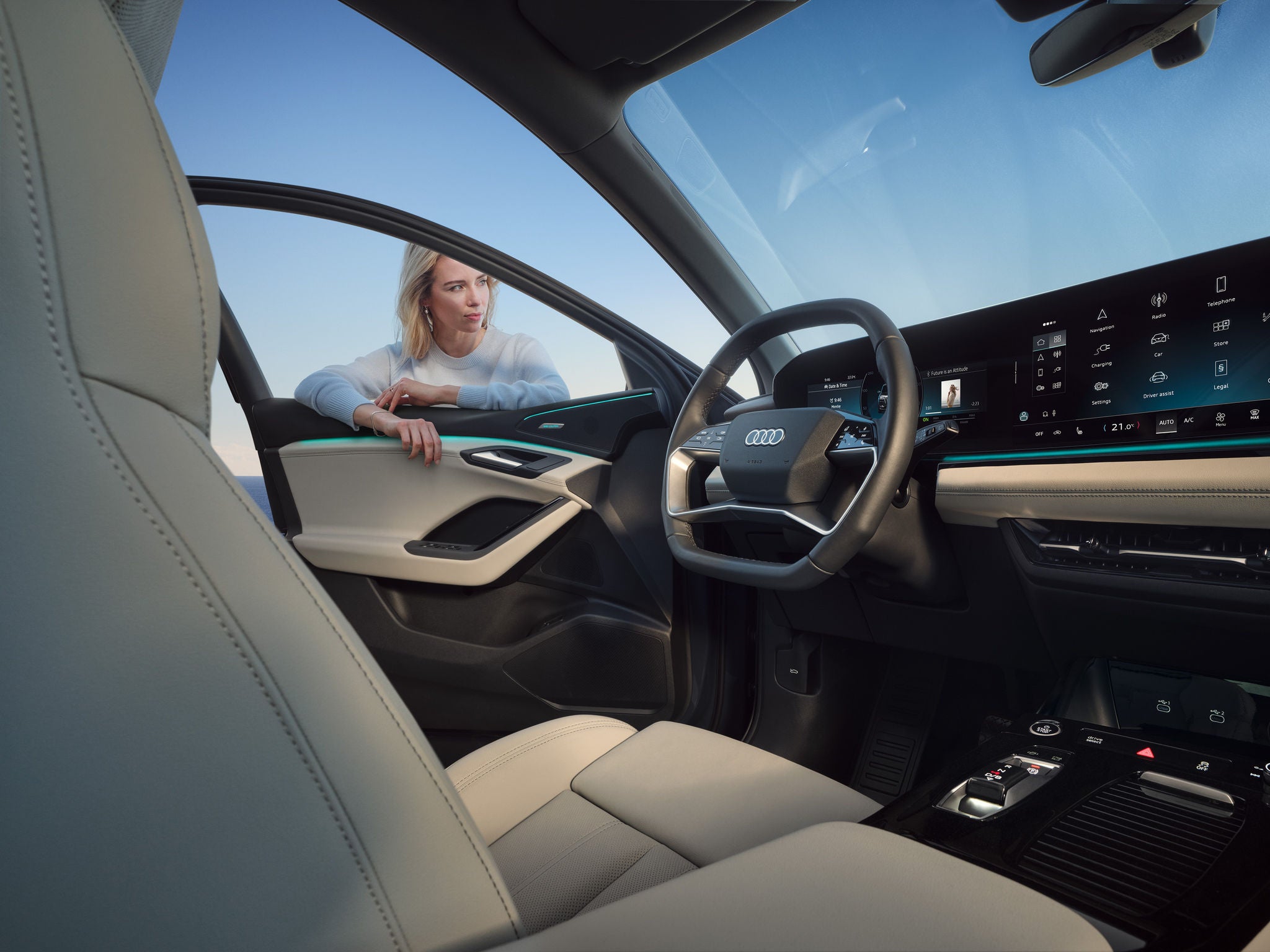 A business-suited woman speaks with another woman, illustrating a moment of professional interaction.