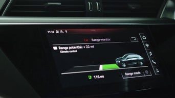 Close up of a dashboard display showing range monitor calculating the range