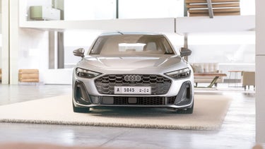 The A5 Sedan is parked in a studio, viewed from the front.