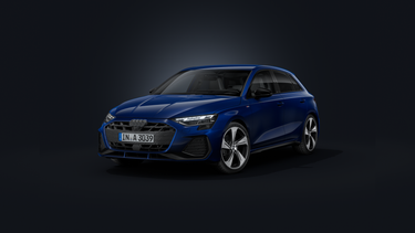 The Audi A3 Sportback, viewed from the front at an angle against a dark background.
