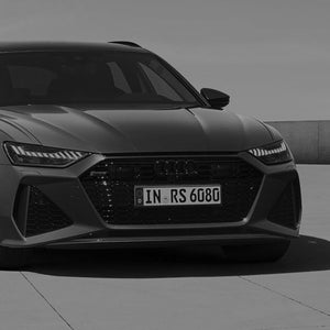 A grey image of the front of an Audi RS 6 car