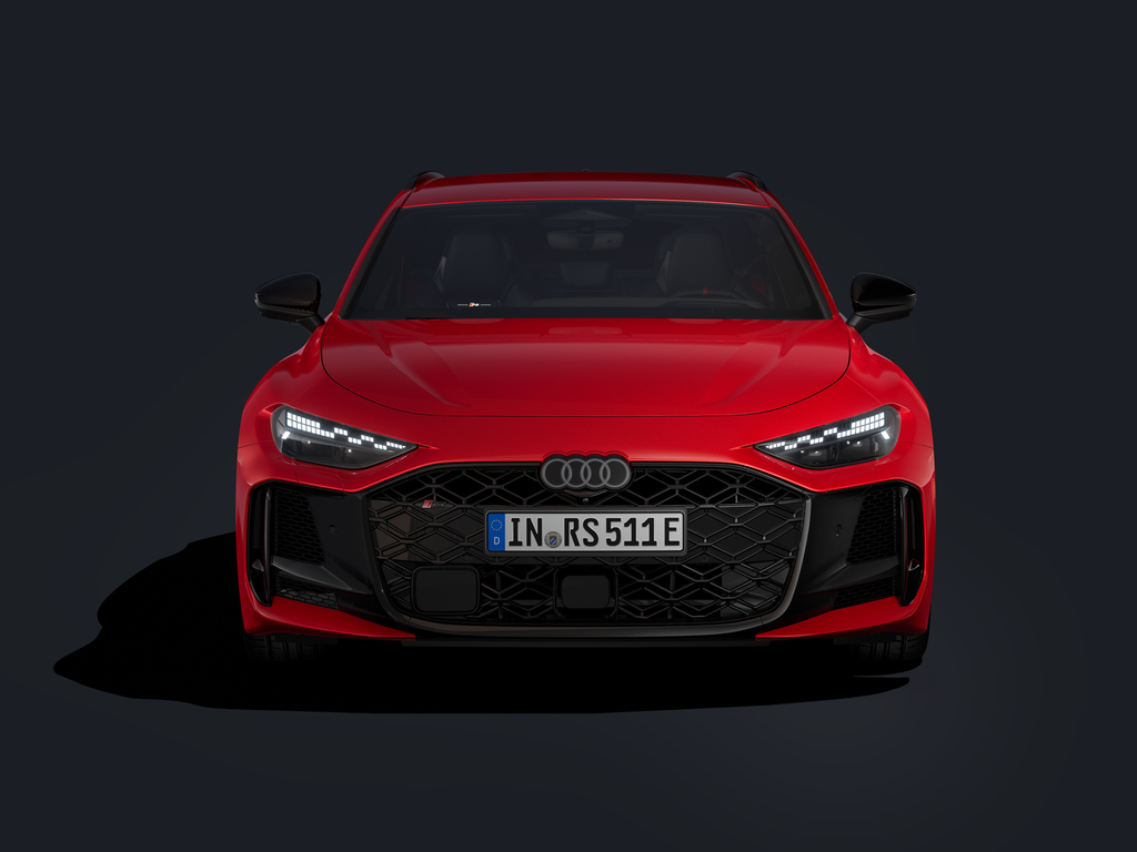 The RS 5 Avant from the front against a dark background.