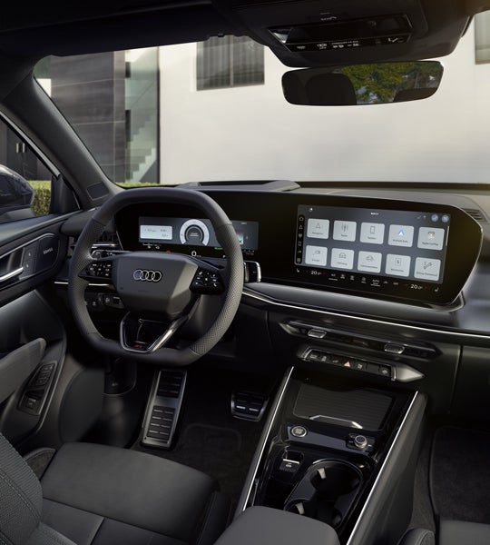 Das Cockpit des Q3 SUV e-hybrid mit Fokus auf die Fahrerarmatur und das Panoramadisplay.