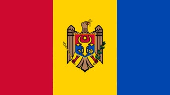 Flag of Moldova with vertical blue, yellow, and red stripes and a national coat of arms in the center.