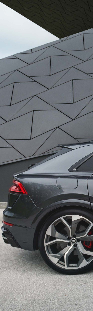 Side view of the RS Q8 with a man