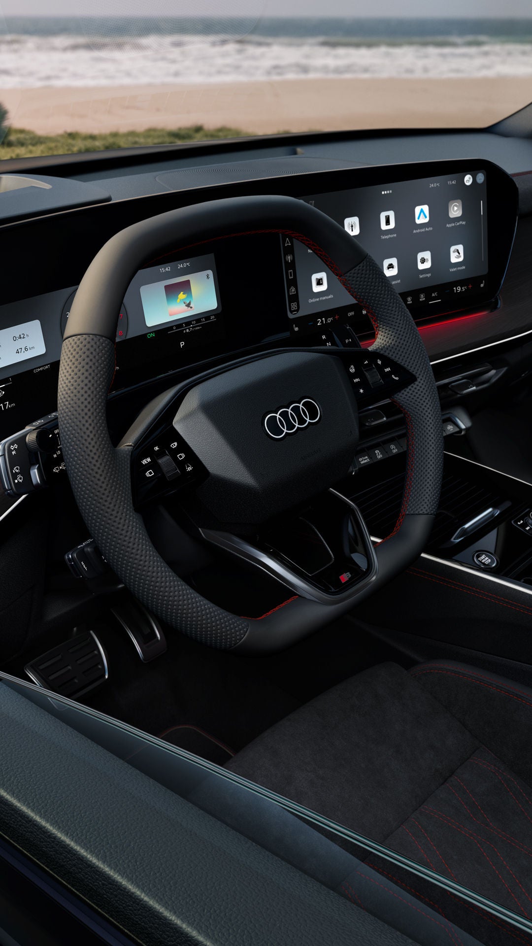 Gli interni dell'Audi Q3 Sportback con volante, display panoramico e pacchetto di illuminazione ambientale rossa.