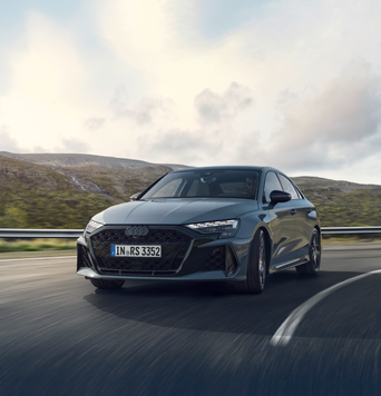 An Audi RS 5 Avant corners on a racetrack.