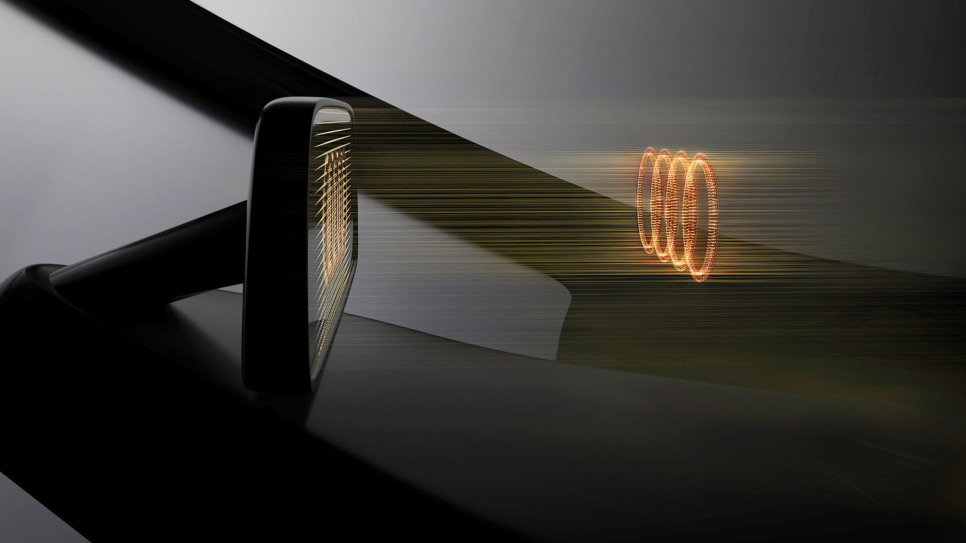 Digitale Rückspiegelanzeige mit Projektion des Audi-Ringsymbols, futuristisches Fahrzeugdetail in Dunkelheit.