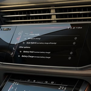 Close-up van een digitaal display waarop verschillende energiemodi kunnen worden geselecteerd.