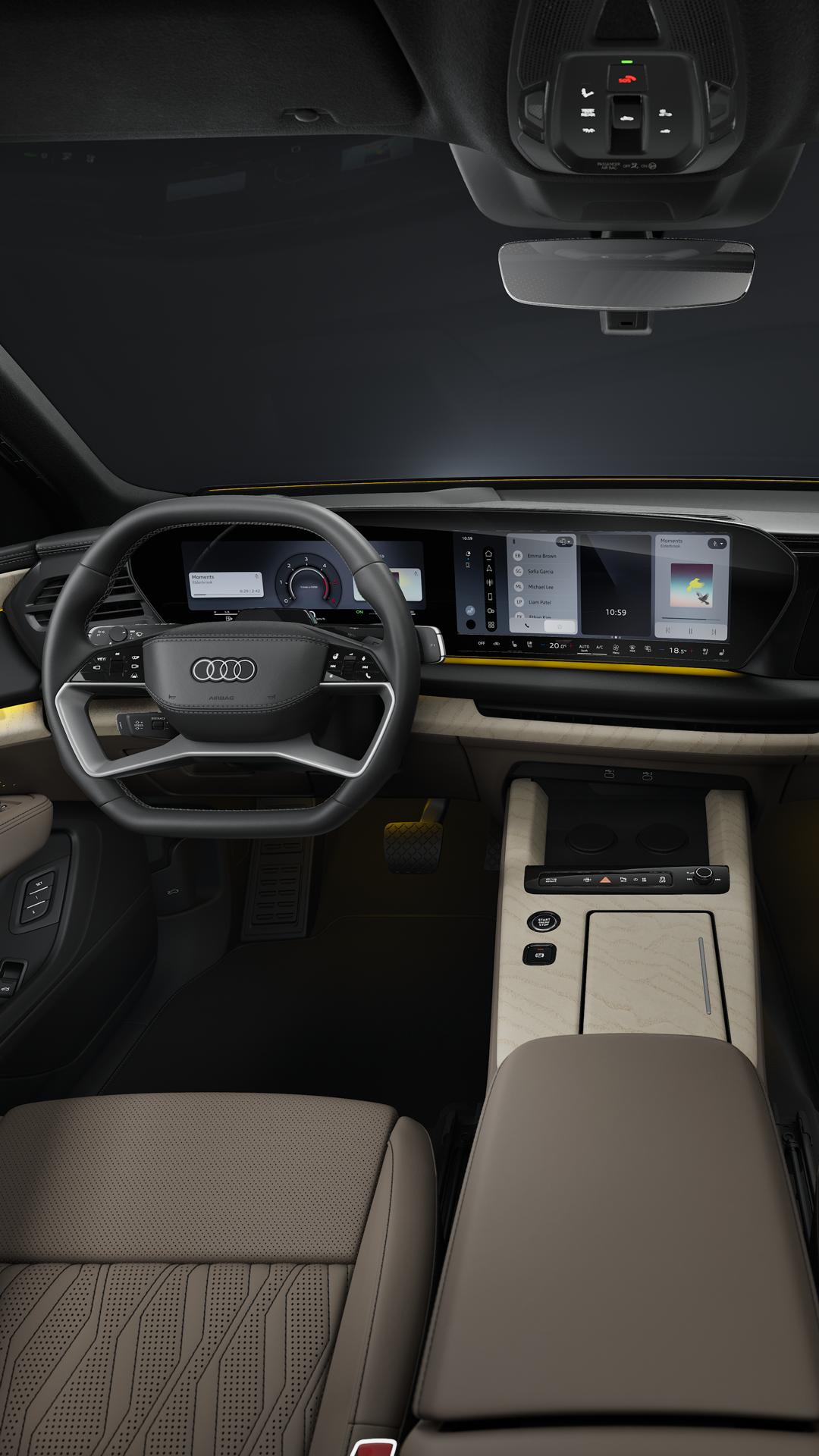 Blick von der Rückbank in das Cockpit des Audi Q9 SUV. Im Fokus das Lenkrad und die Panoramadisplays mit dem Audi Virtual Cockpit und dem MMI Display.