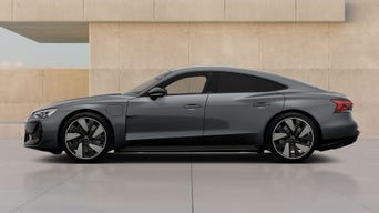 gun metal RS e-tron GT parked near beige wall