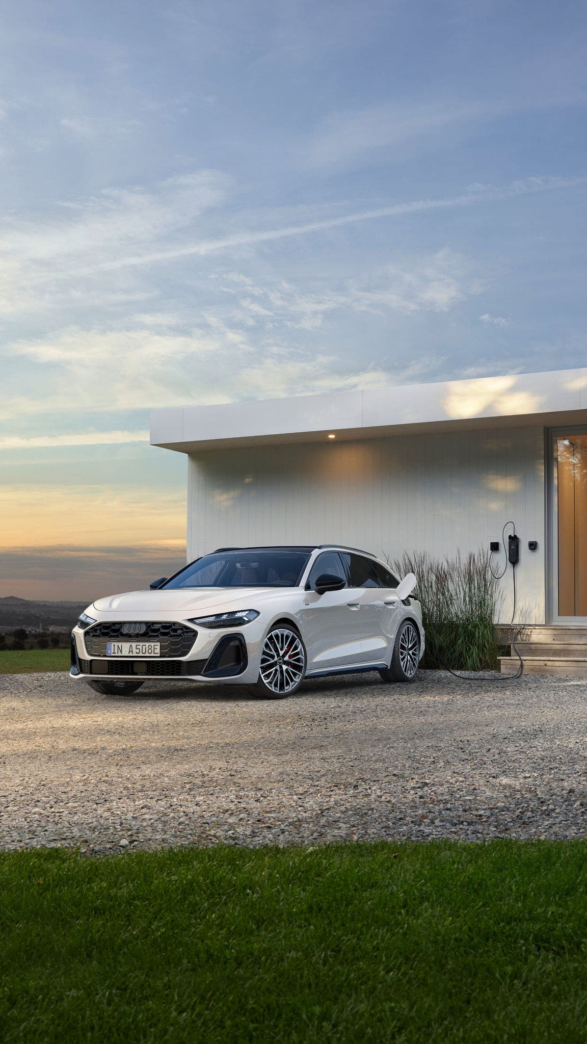 Audi A5 Avant e-hybrid in a parking lot in half side view