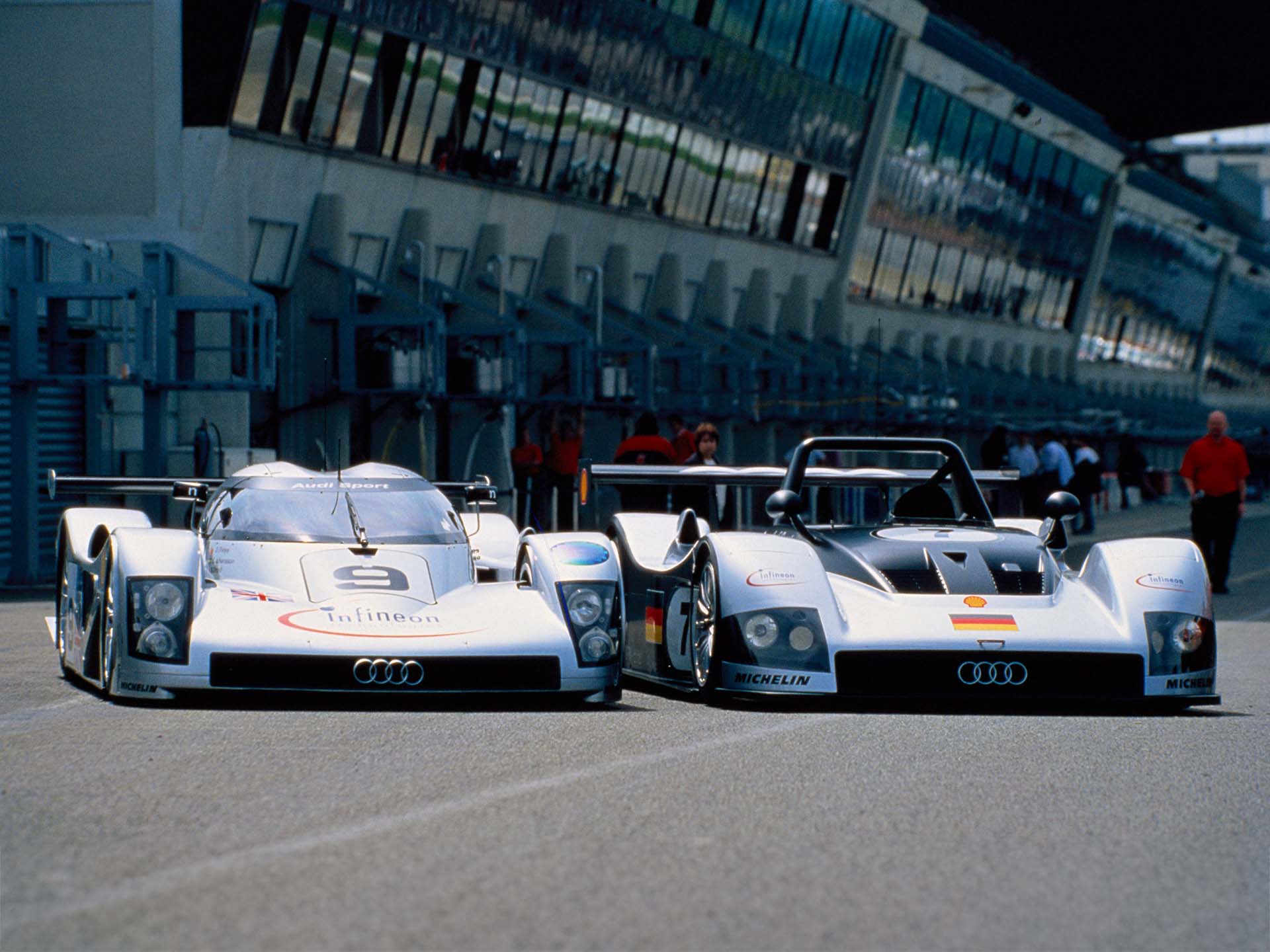 A picture showing the Audi R8C and Audi R8R race cars at Le Mans in 1999.