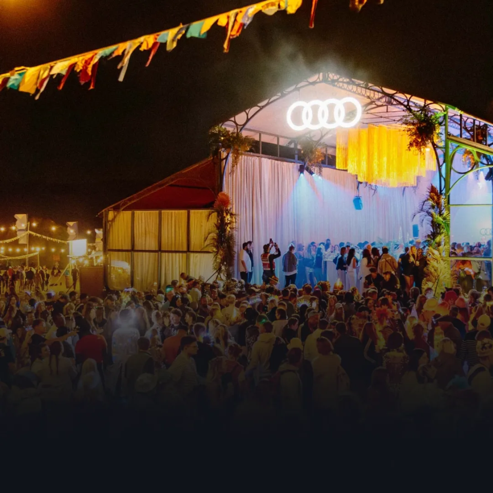 Audi presents wilderness with Audi logo and tent at "Wilderness" event