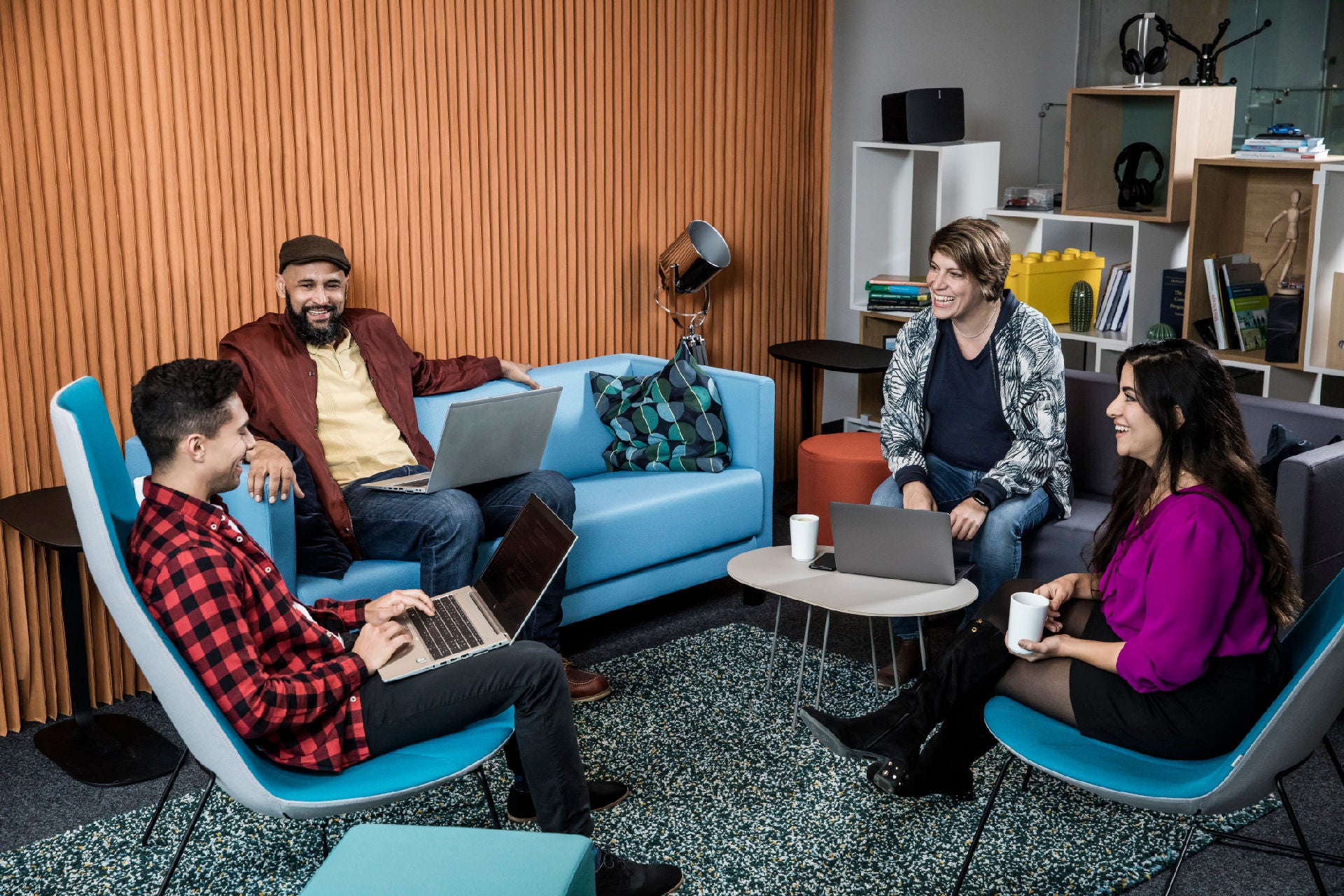 Group of employees sitting in the lounge area