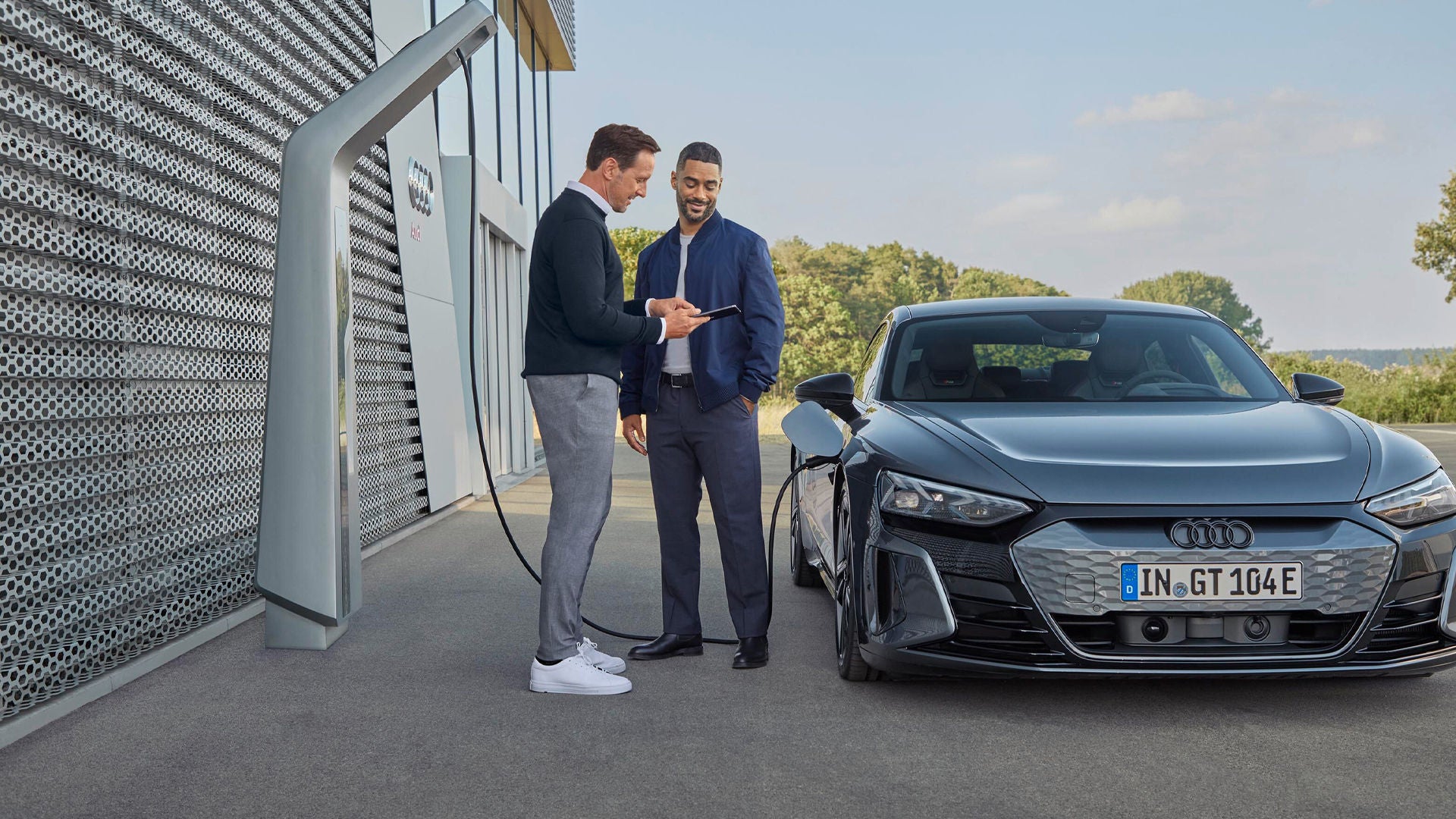 Woman and an Audi A6 Avant e-tron