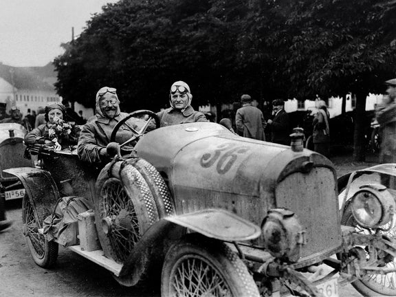 Black and white photo of several people in the Audi Type C Alpine Champion