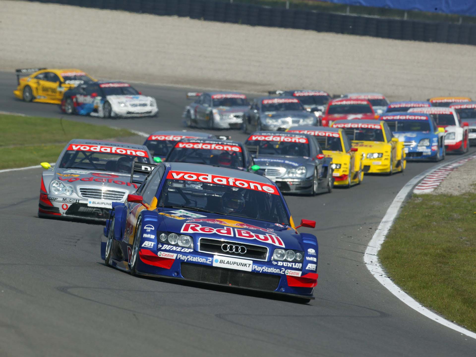A picture showing Mattias Ekström’s Audi A4 DTM leading the race at Zandvoort in 2004.