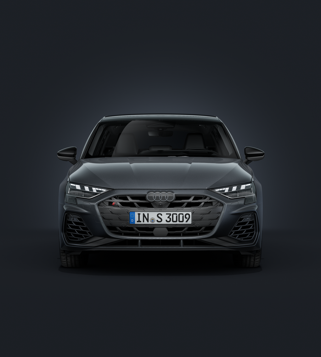 Der Audi S3 Sportback frontal von vorn auf dunklem Hintergrund.