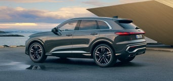 Blue Audi Q5 SUV on the street.