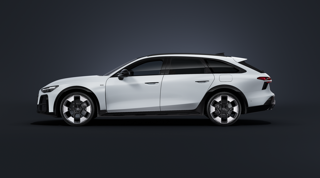 The Audi A6 allroad e-hybrid, viewed from the side against a dark background.