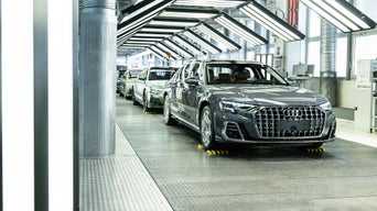 Several Audi A8 models in a row at the plant.