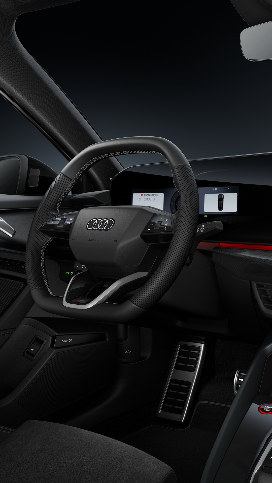 Blick auf das Cockpit mit Fokus auf das Sportlederlenkrad und das geschwungene Panoramadisplay.
