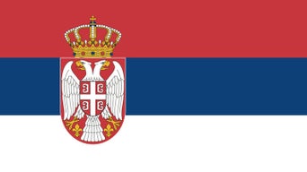 Flag of Serbia with red, blue, white stripes and national coat of arms on left.