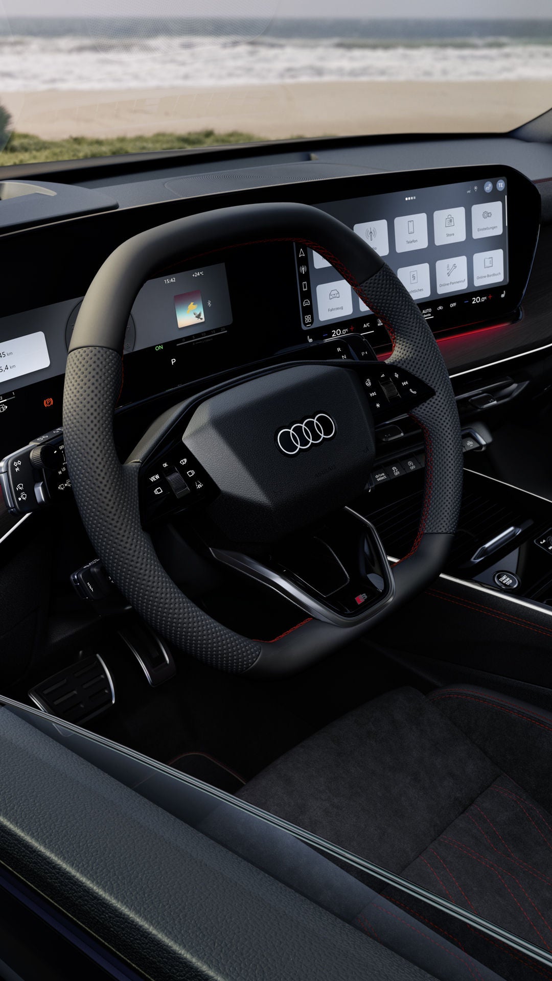 Das Interior des Q3 Sportback mit Lenkrad, Panoramadisplay und rotem Ambiente-Lichtpaket.