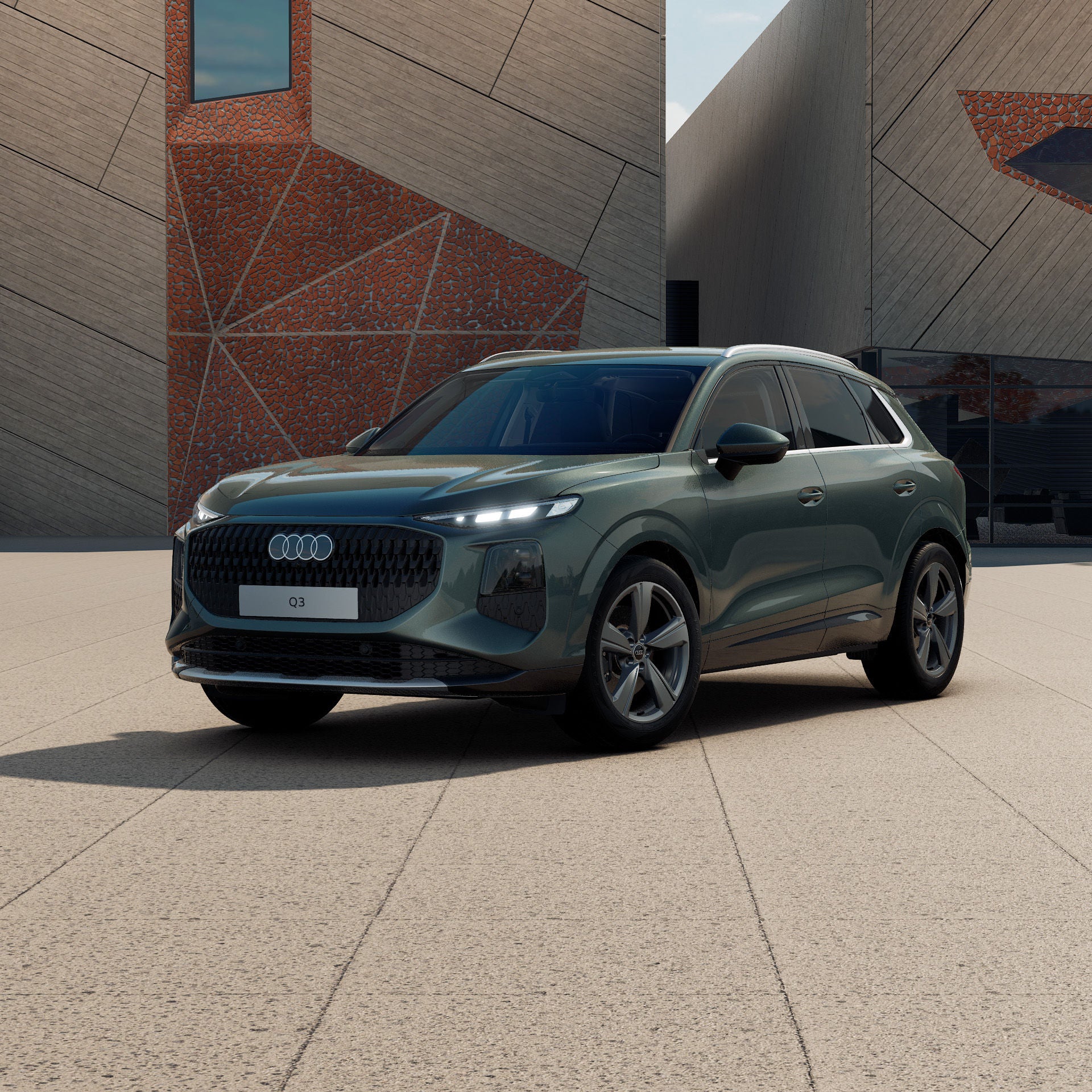 Ein Audi Q3 SUV in Salbeigrün Metallic schräg von vorne fotografiert vor einer futuristischen Kulisse