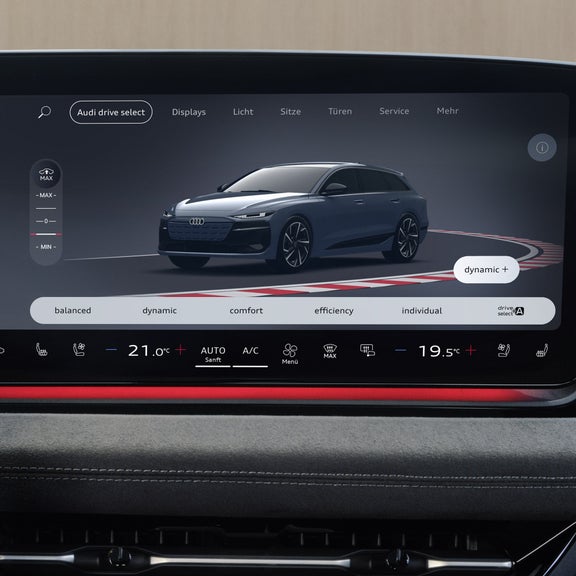 Nahaufnahme des MMI touch-Displays im Cockpit des S6 Sportback e-tron. Der Bildschirm zeigt die Auswahl der Audi drive select-Modi.