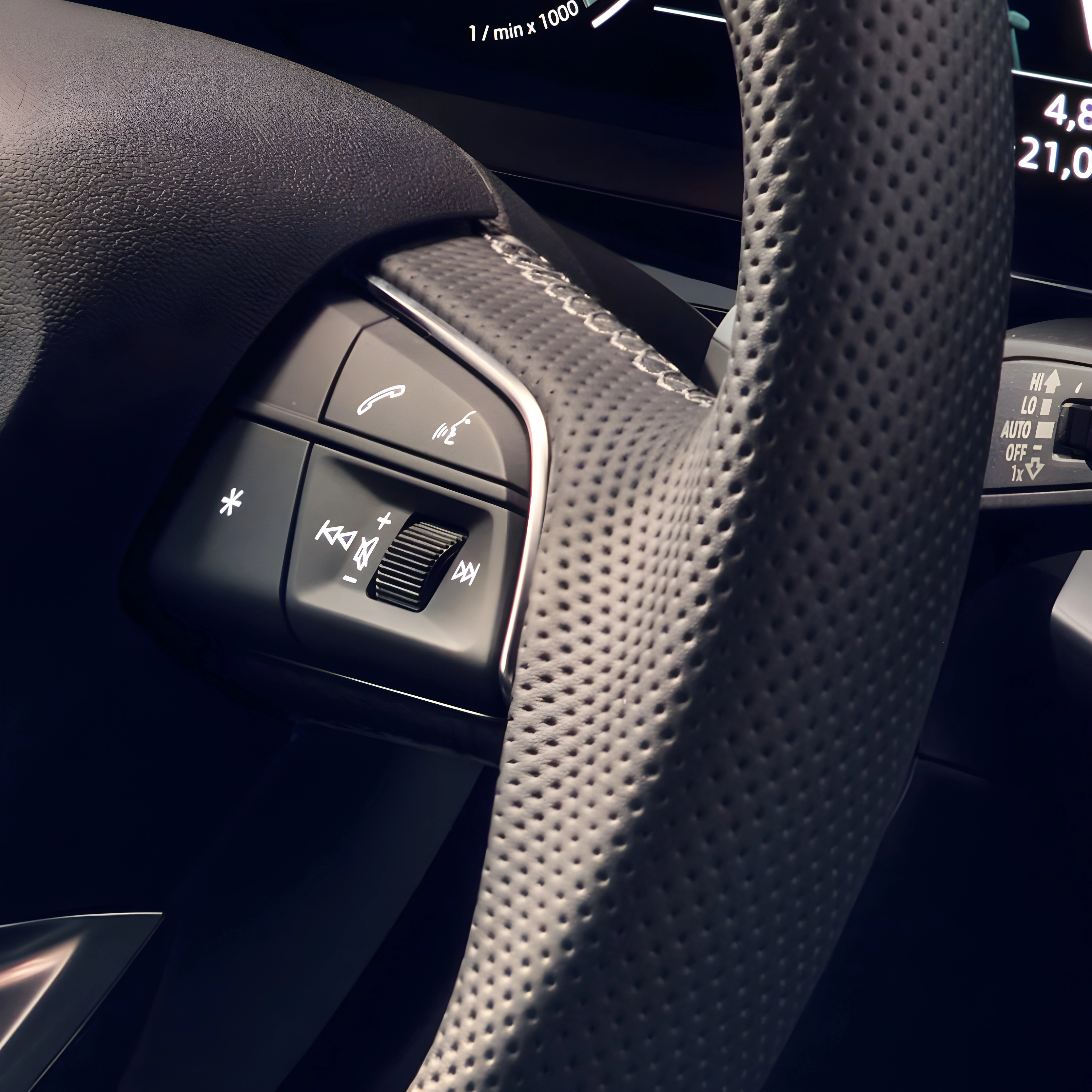 Steering wheel of an Audi A3 Sportback with control buttons.
