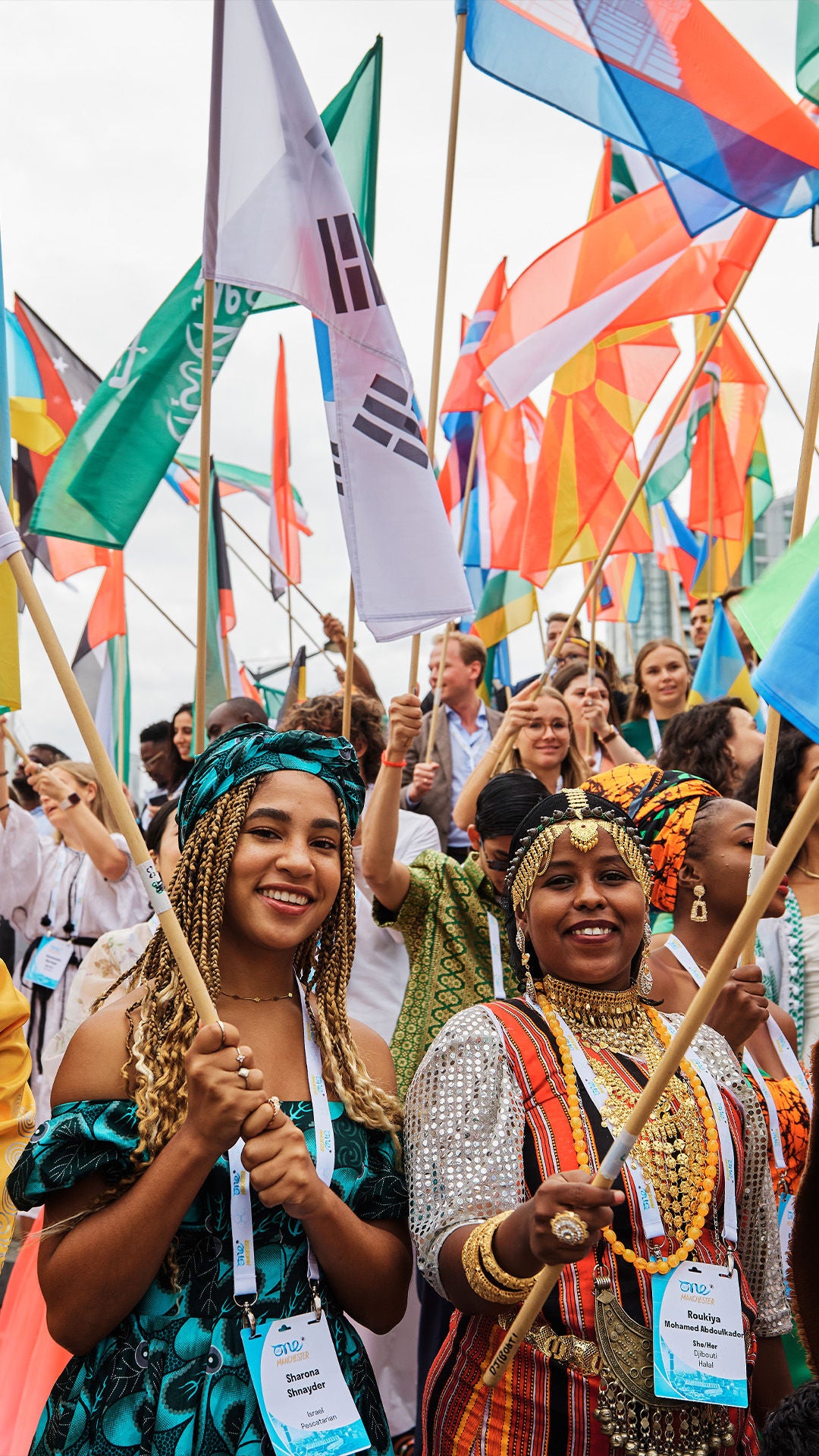 Young people waving flags