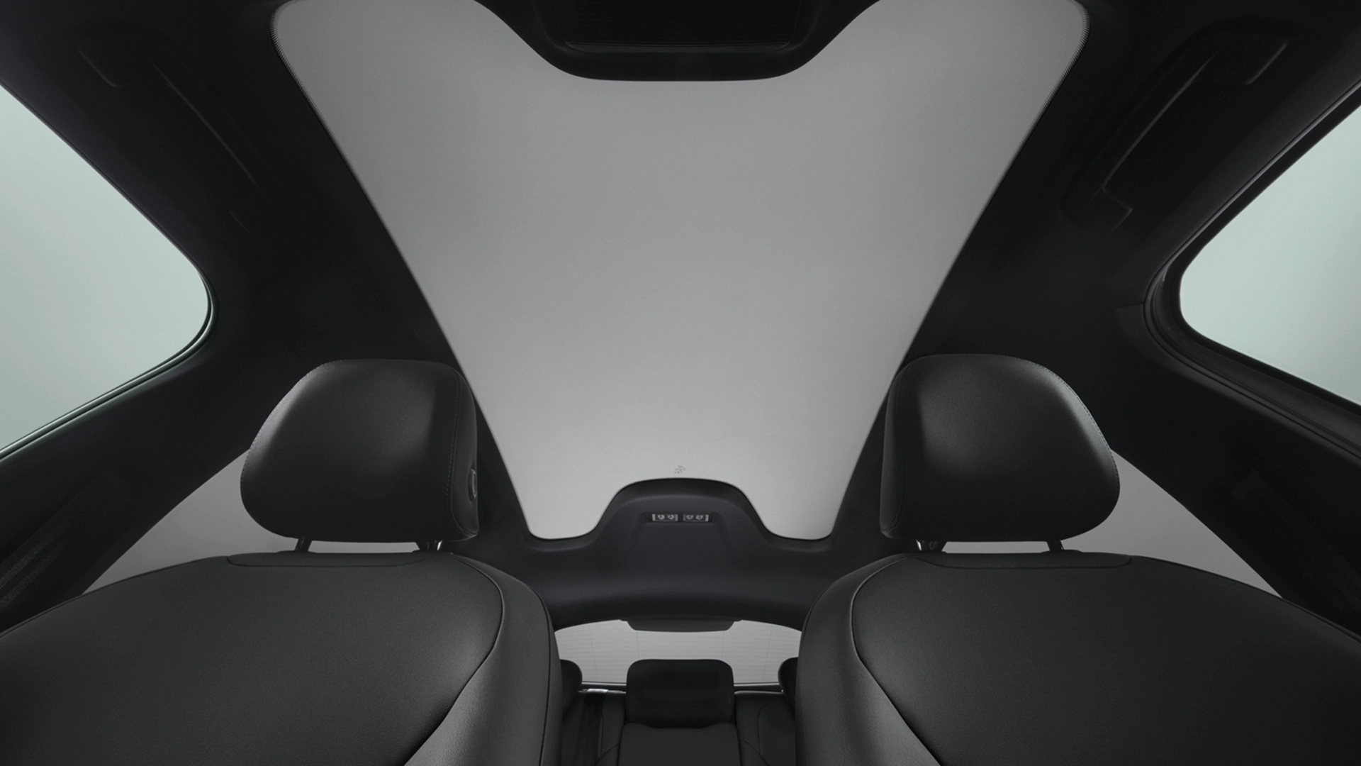 Panoramic glass sunroof interior view of the Audi A2 e-tron electric car with black leather seats