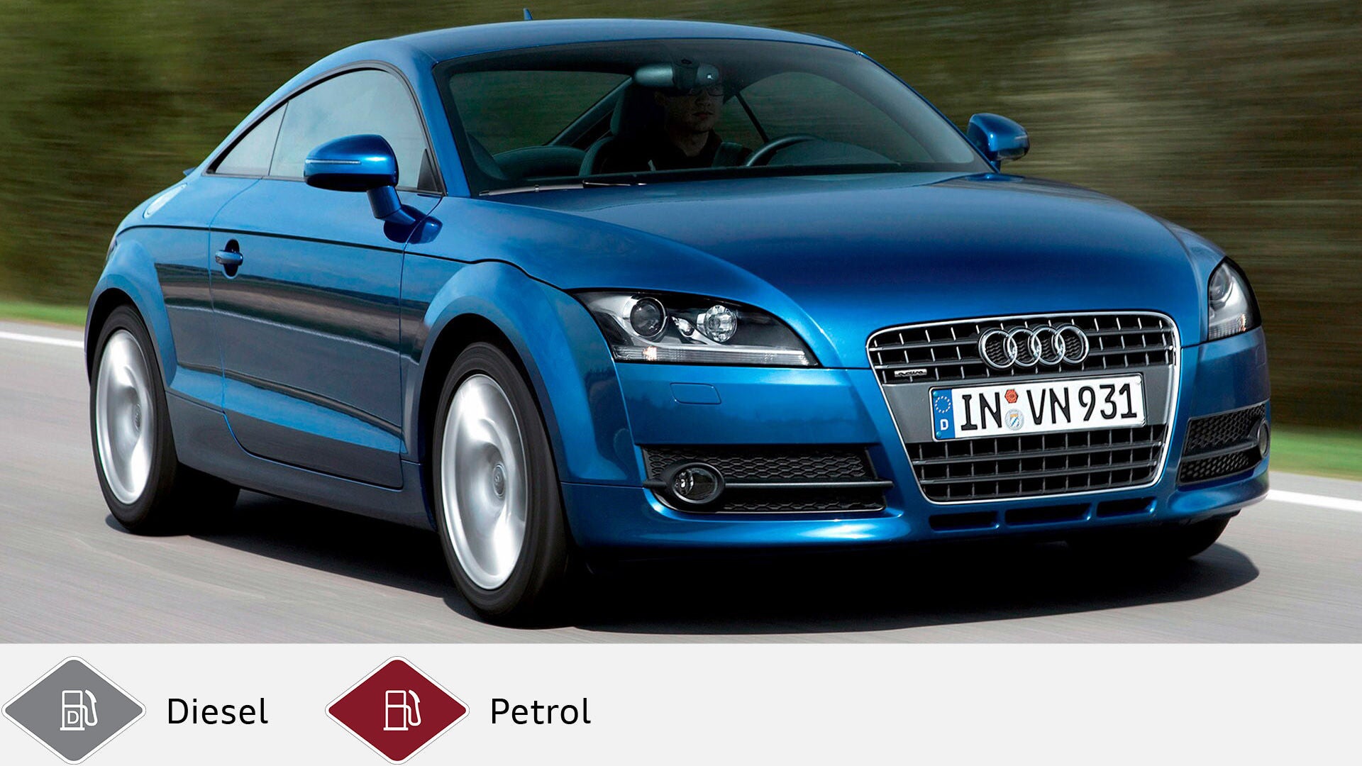 Blue Audi TT Coupé on a country road with driver in the vehicle. Below gray diesel symbol and red gasoline symbol.