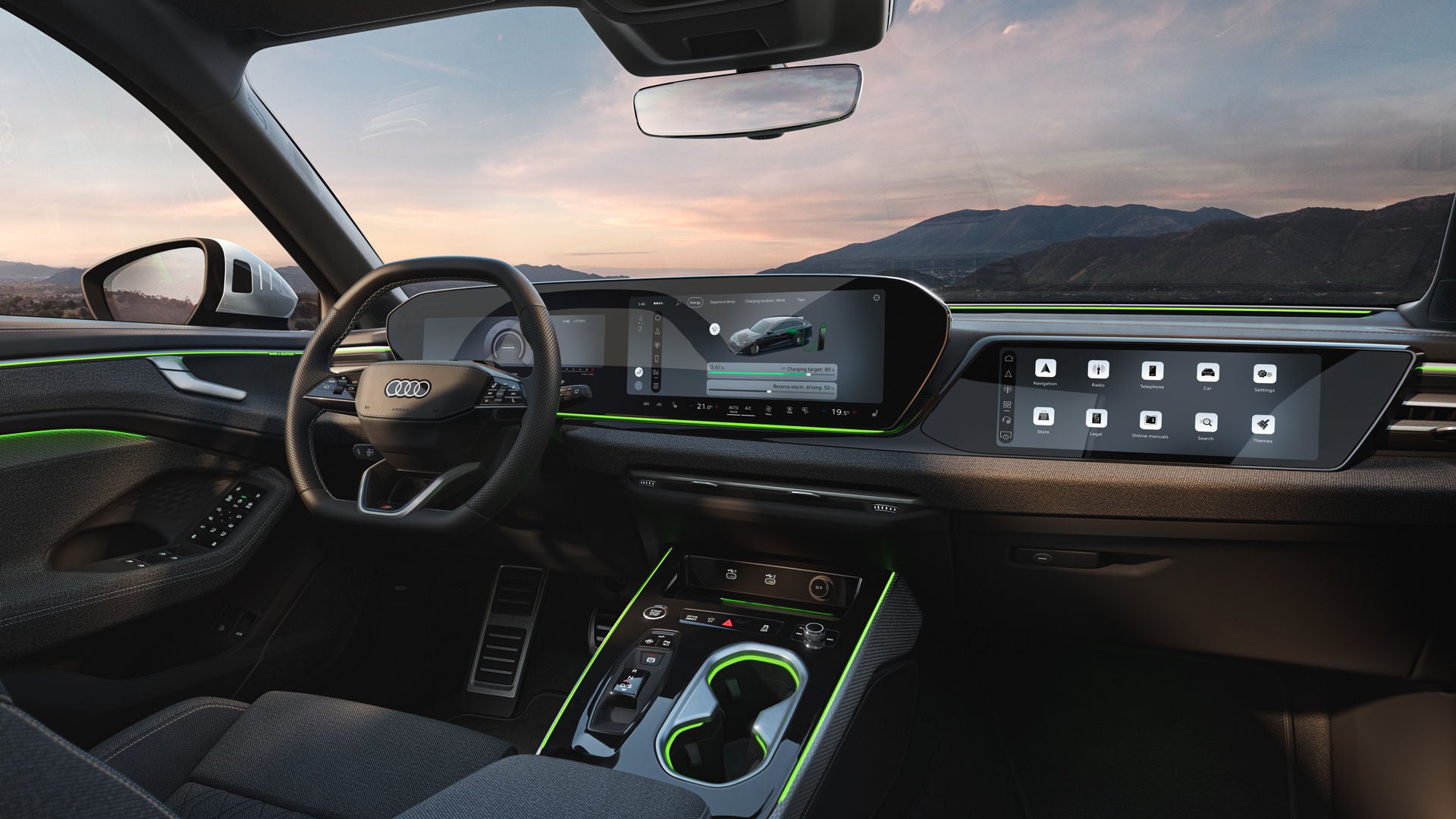 Zicht op de displays en het stuur in de cockpit van de Audi A6 Avant e-hybrid. Door de voorruit zijn bergen zichtbaar.