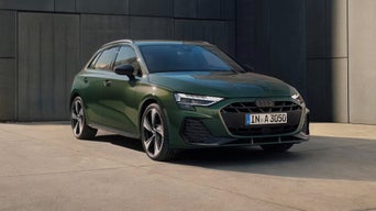  Slightly side view of a green Audi car