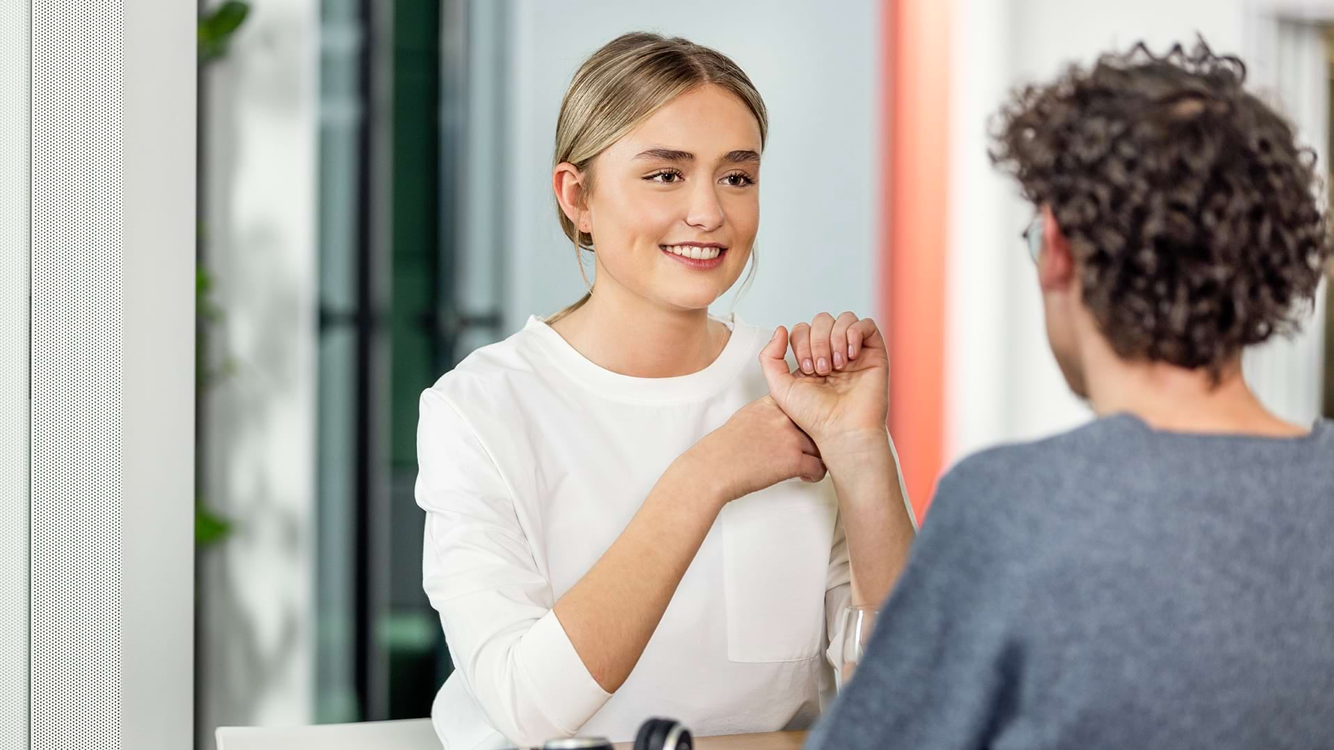Two young people talking to each other