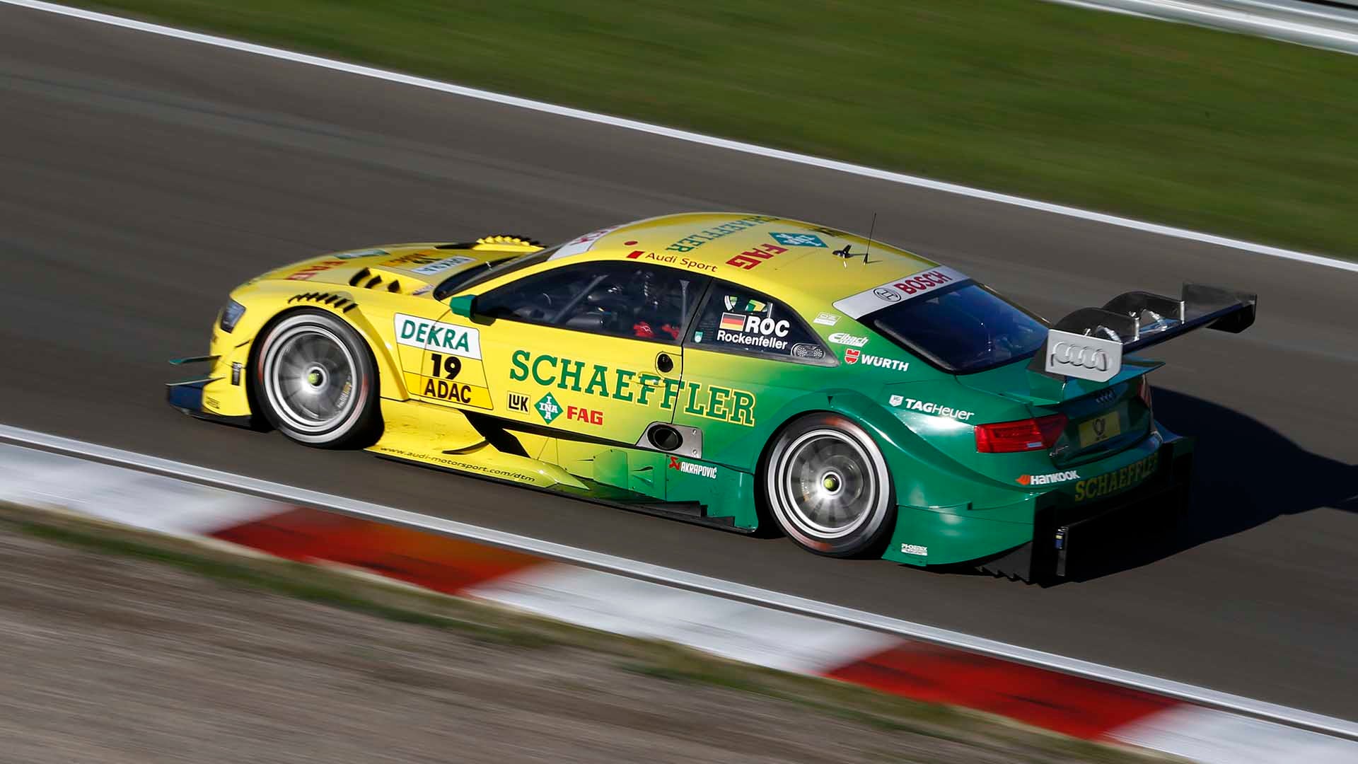 A picture showing Mike Rockenfeller’s Audi RS 5 DTM race car on track at Zandvoort in 2013.
