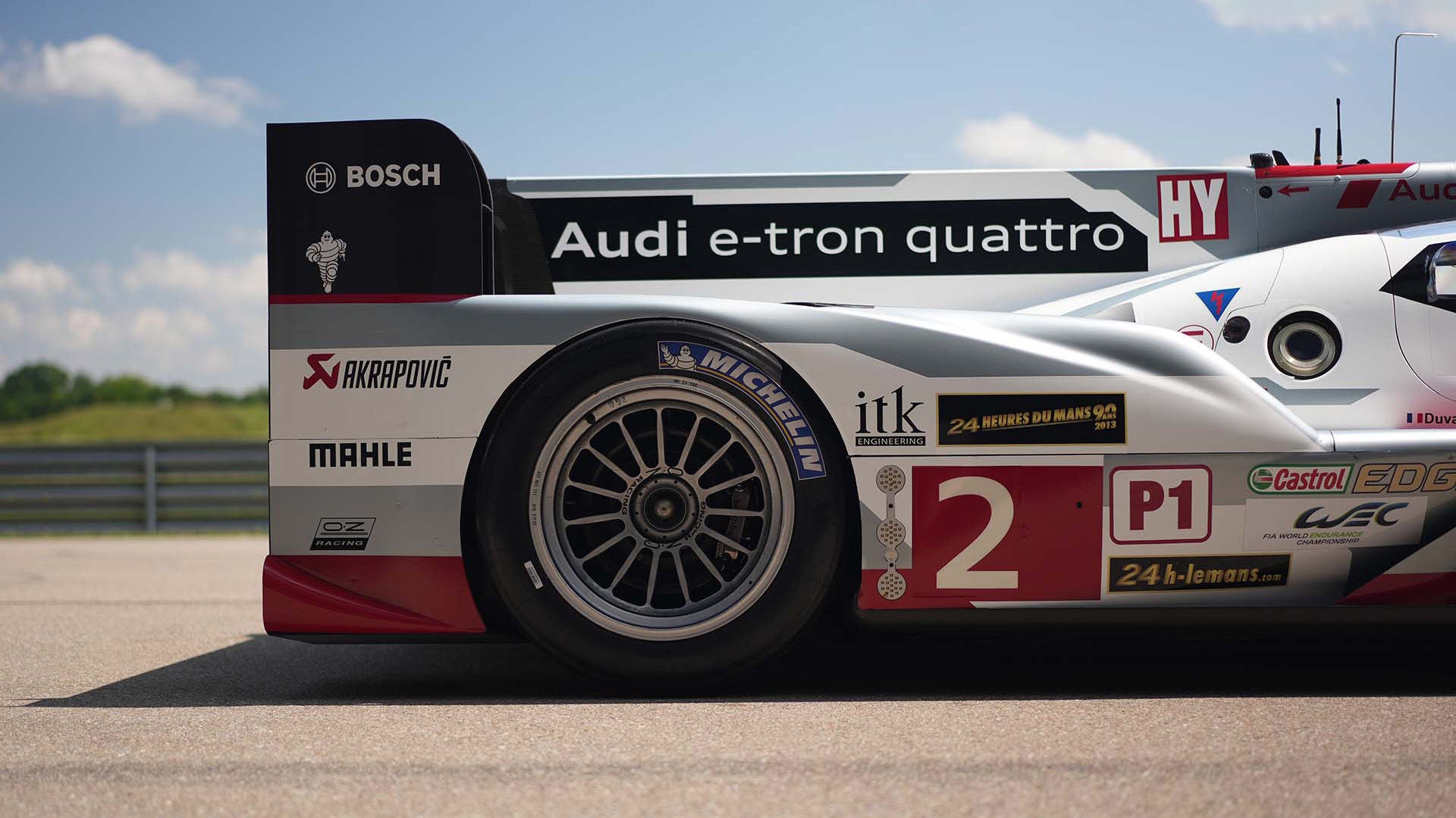 A picture showing the back of an Audi R18 e-tron quattro race car on display in Neuburg.
