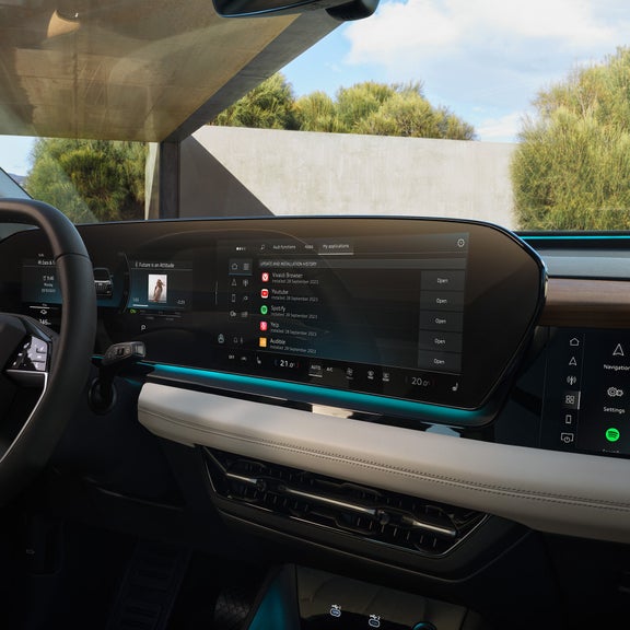 Man in the Audi taps on the Audi display